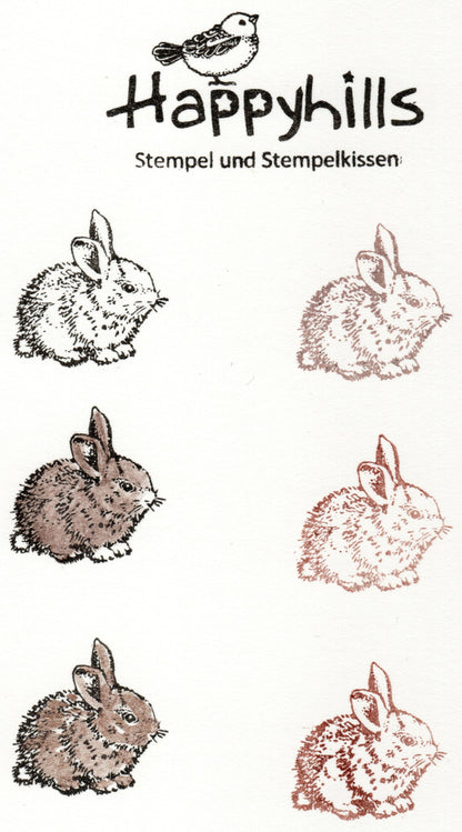 Stempel Kaninchen sitzt und Karotte